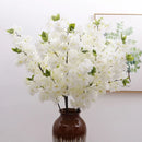 Wedding arch decoration with artificial silk cherry blossom branches