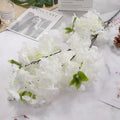 Wedding arch decoration with artificial silk cherry blossom branches