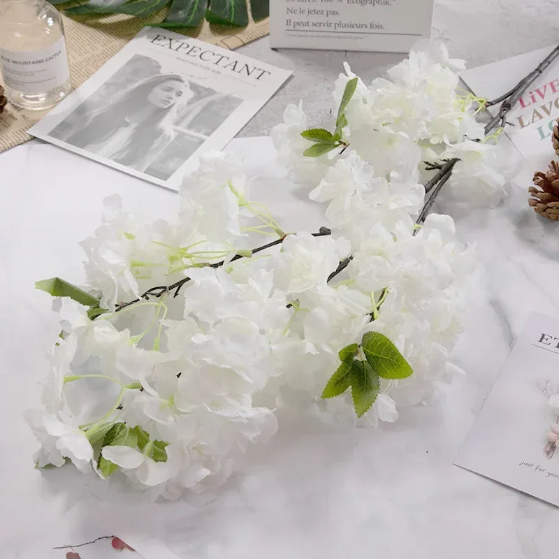 Wedding arch decoration with artificial silk cherry blossom branches