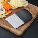 Stainless steel French fry cutter.