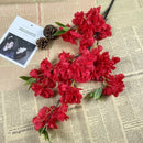 Wedding arch decoration with artificial silk cherry blossom branches