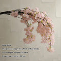 Wedding arch decoration with artificial silk cherry blossom branches