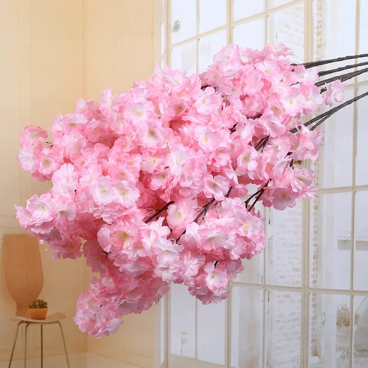Wedding arch decoration with artificial silk cherry blossom branches