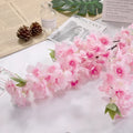 Wedding arch decoration with artificial silk cherry blossom branches