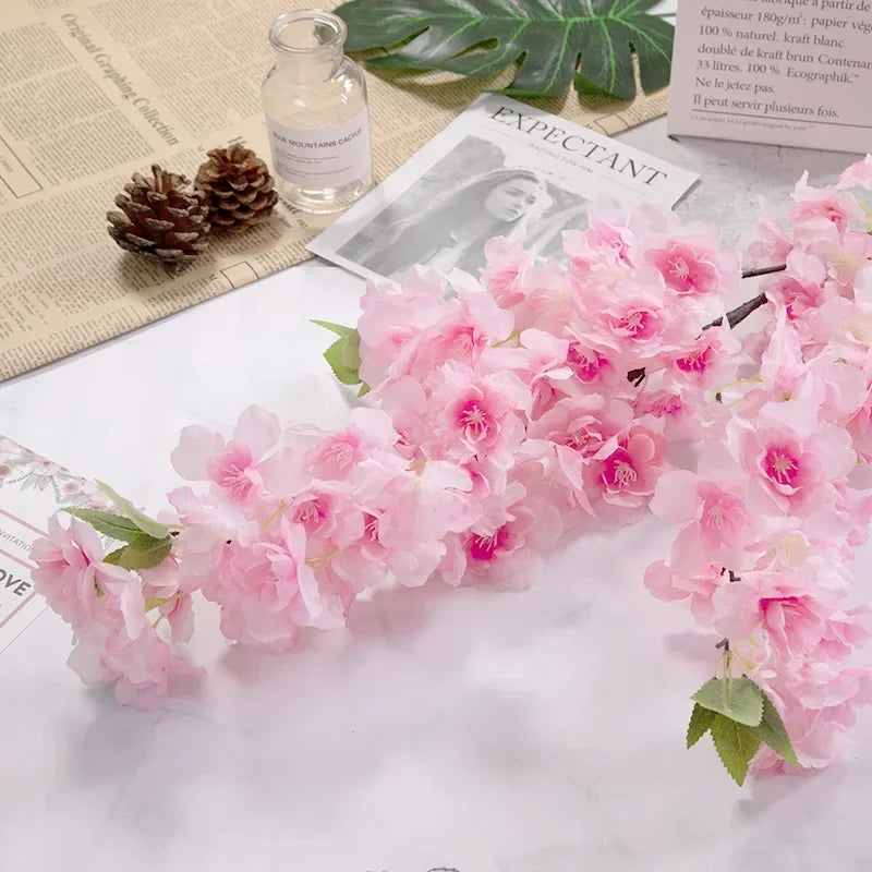 Wedding arch decoration with artificial silk cherry blossom branches