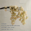 Wedding arch decoration with artificial silk cherry blossom branches