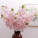 Wedding arch decoration with artificial silk cherry blossom branches