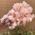 Wedding arch decoration with artificial silk cherry blossom branches