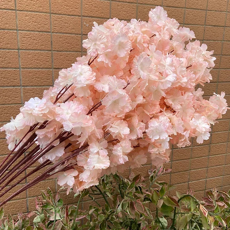 Wedding arch decoration with artificial silk cherry blossom branches