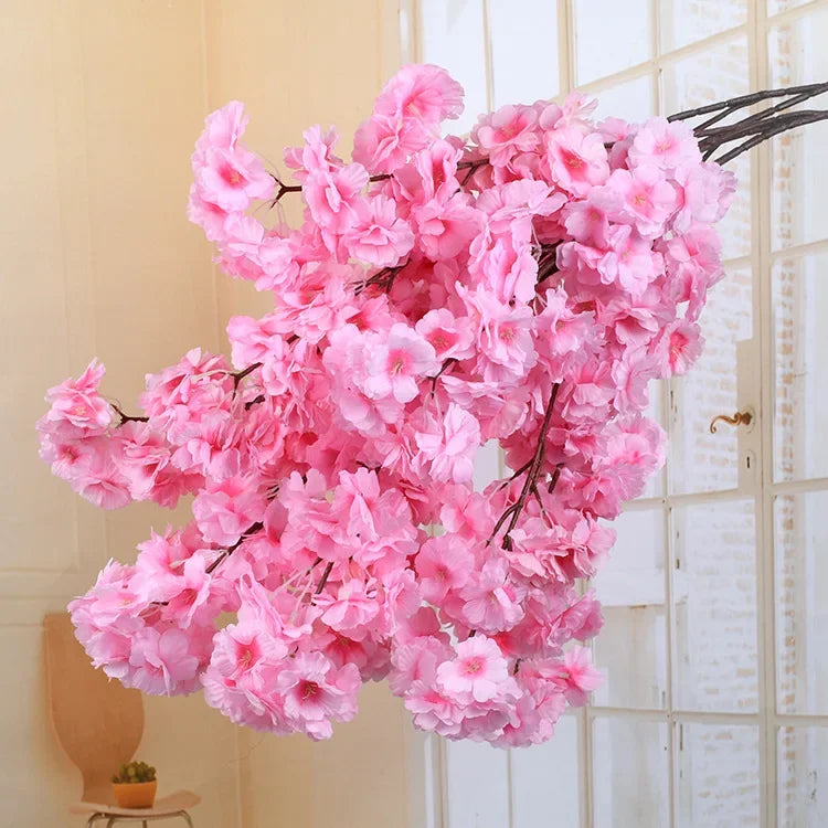 Wedding arch decoration with artificial silk cherry blossom branches