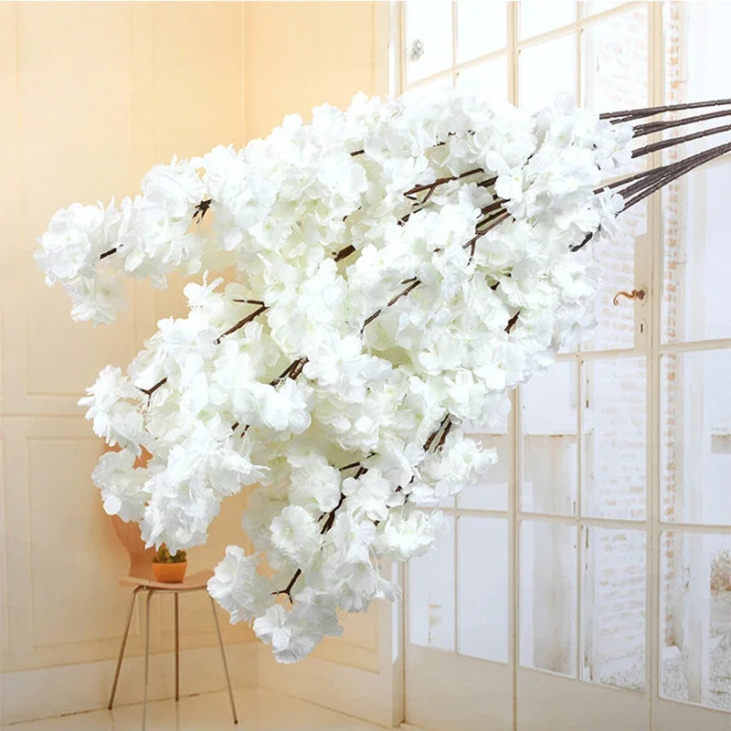Wedding arch decoration with artificial silk cherry blossom branches
